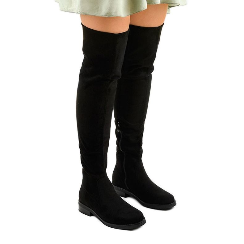 Black flat ankle boots with a long Aeleos upper