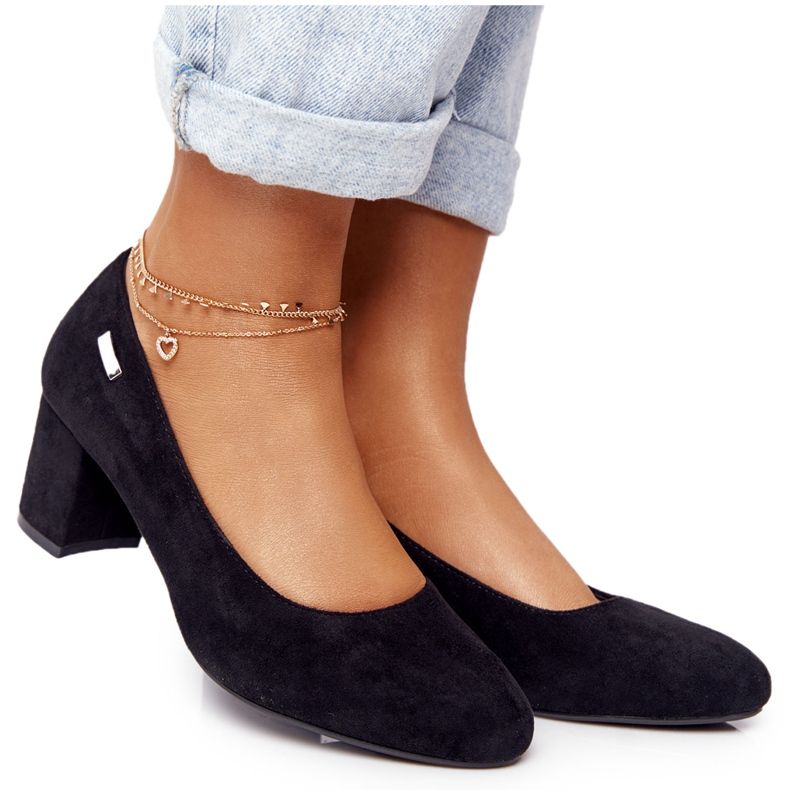 Suede Pumps On A Sergio Leone Black Bar