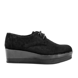 Black suede shoes on a high Elisabeth sole