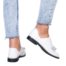 White shiny shoes with a Lost Stars bow