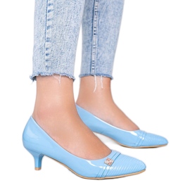 Blue pumps on Molly's low heel