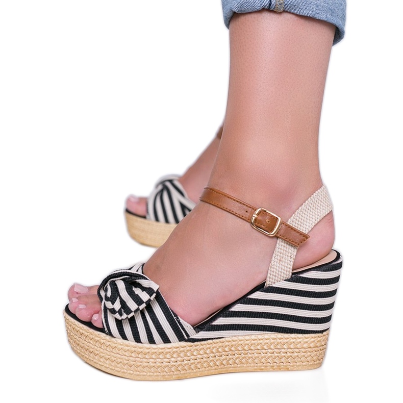 Black and white wedge sandals with a Holiday Vibes bow