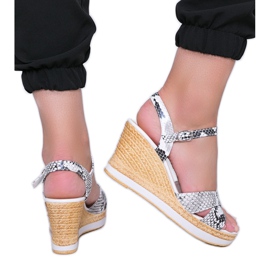 White wedge sandals in the Peekaboo snake skin pattern