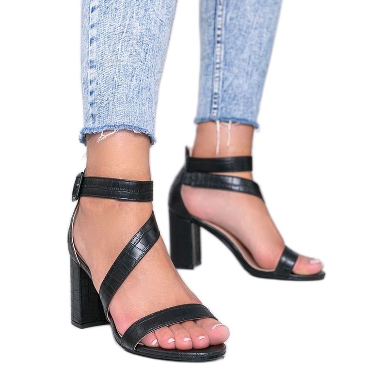 Black sandals on a Silver Dust post