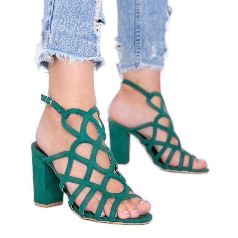 Green openwork sandals on the Imani post