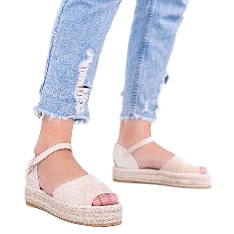 Beige sandals on the Pearl River platform