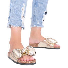 Gold slippers with a Norris bow golden Gold slippers with a Norris bow golden