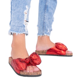 Red slippers with a Norris bow