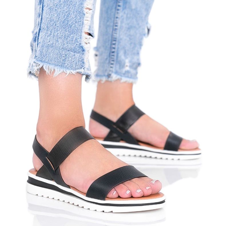 Black sandals on a chunky Cro sole