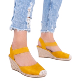 Yellow espadrilles on Louise's wedge
