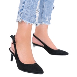 Black pumps on a Tari heel