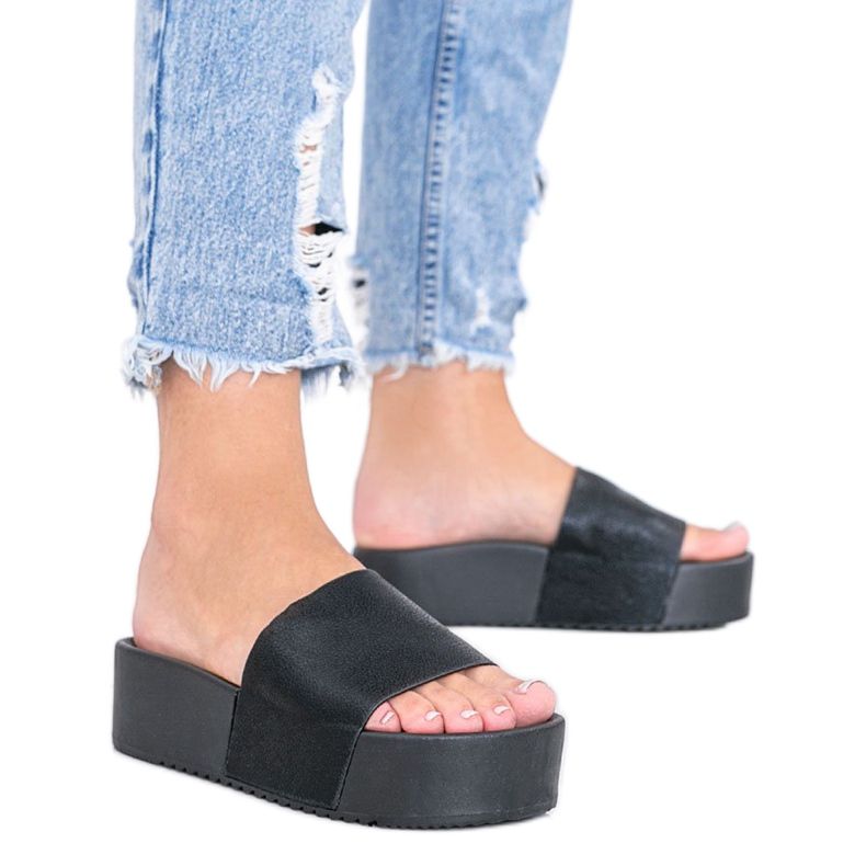 Black slippers on a thick Crysta sole