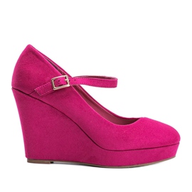 Pink high wedge pumps