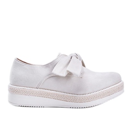 Beige shoes with a thick Sindri sole