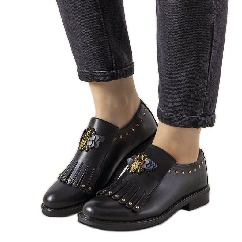 Black slip-on shoes with GF-FD9 studs