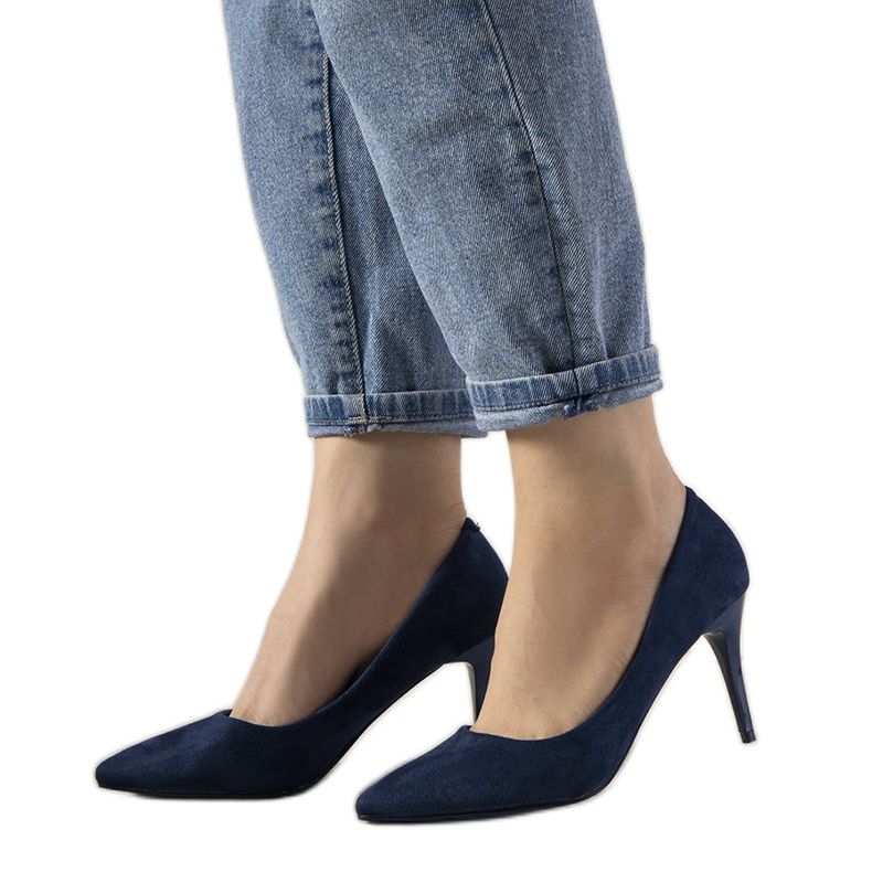 Navy blue pumps on Eliana's low heel