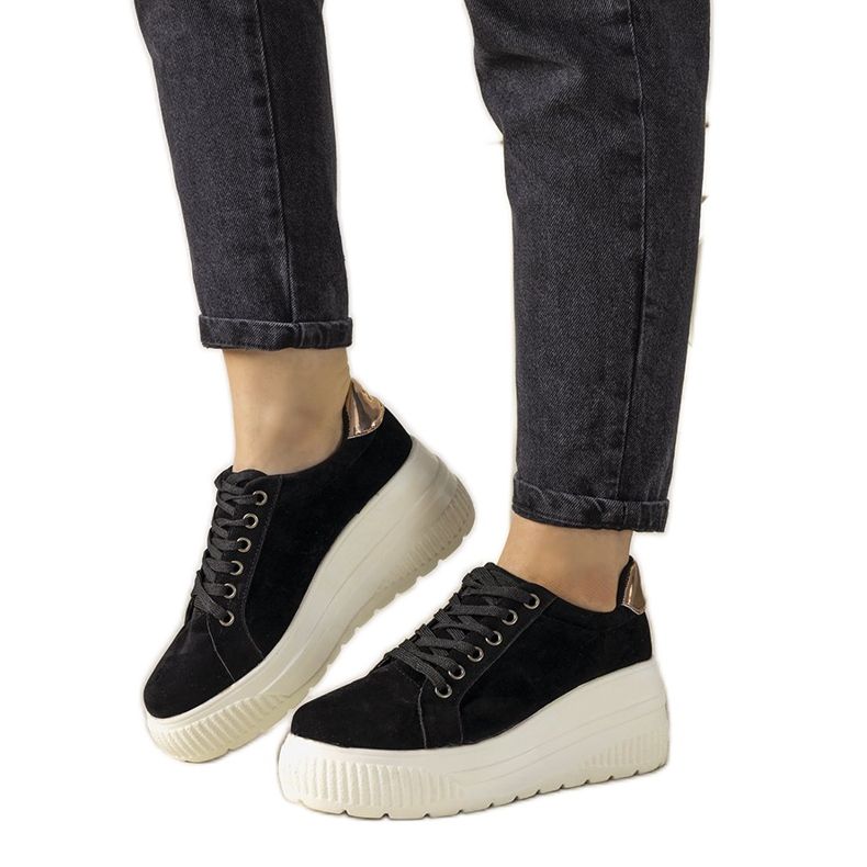 Black sports sneakers with a high Rapter sole