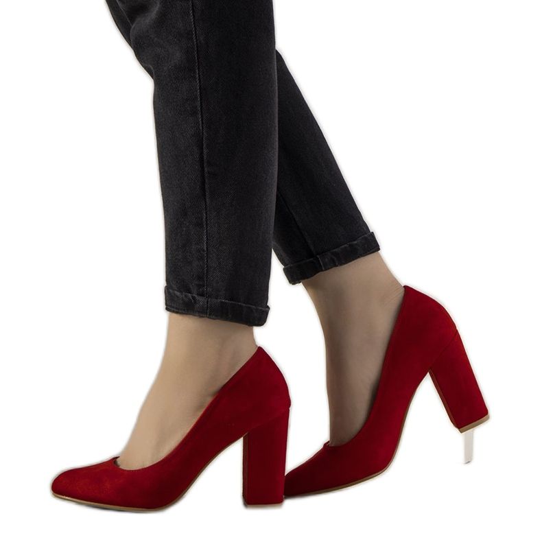 Red pumps on the Selva post