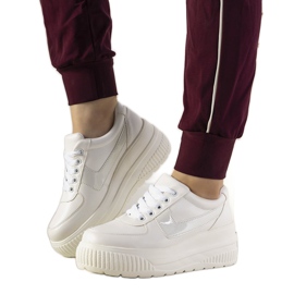 White sports sneakers with a high Challenge sole