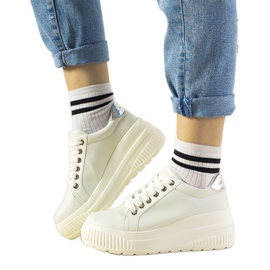 White sports sneakers with a high Under sole