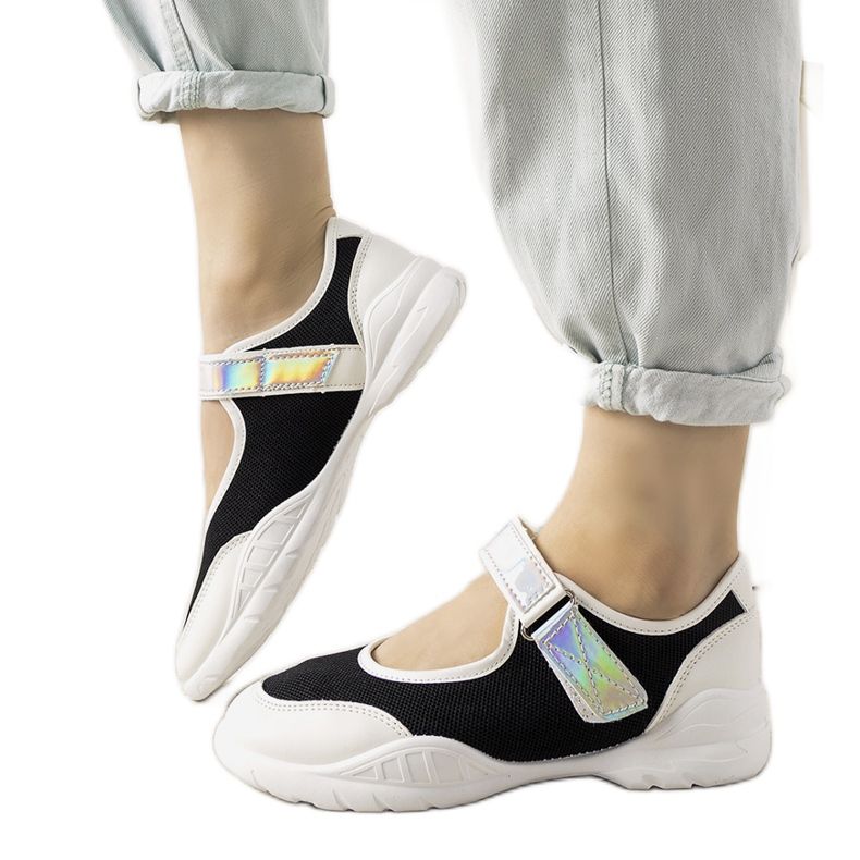 Black and white trainers with a holographic Melania insert