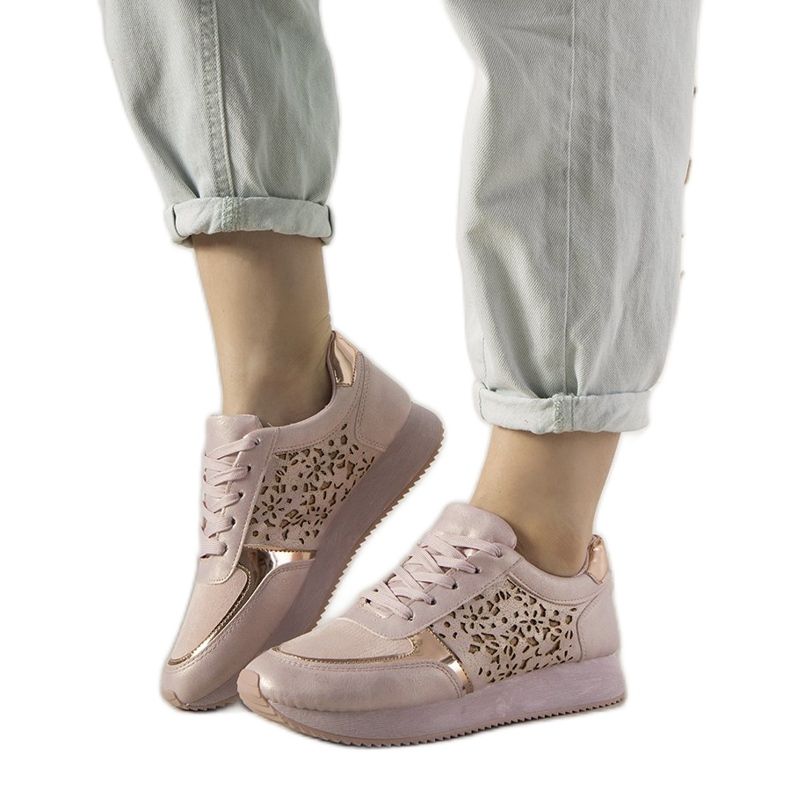 Pink sports sneakers with an openwork Festival pattern