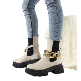 Beige boots with Attention chain