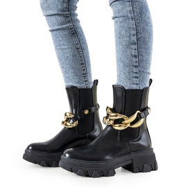 Black ankle boots with Attention chain