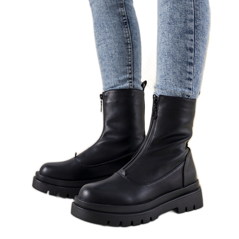 Black ankle boots on a high Cowber sole