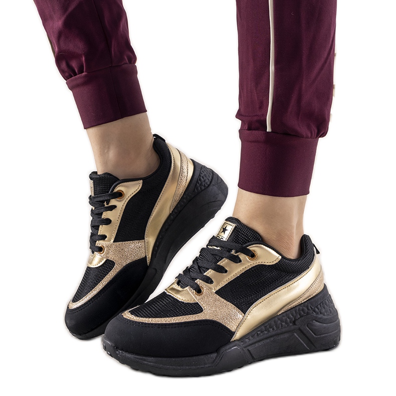 Black sneakers with gold Montessori inserts golden