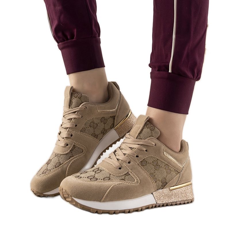 Beige sneakers with golden Moves accessories