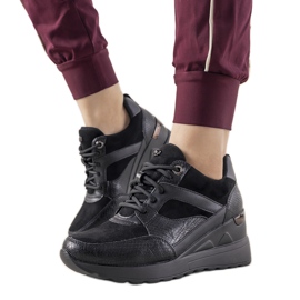 Black sneakers with a snake skin pattern from Halsey