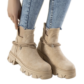 Beige boots with a Fearless bracelet Beige boots with a Fearless bracelet