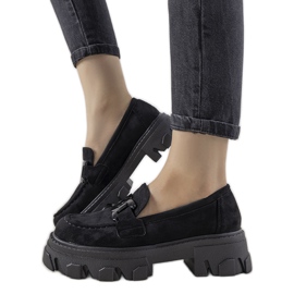 Black loafers on a high Perla sole