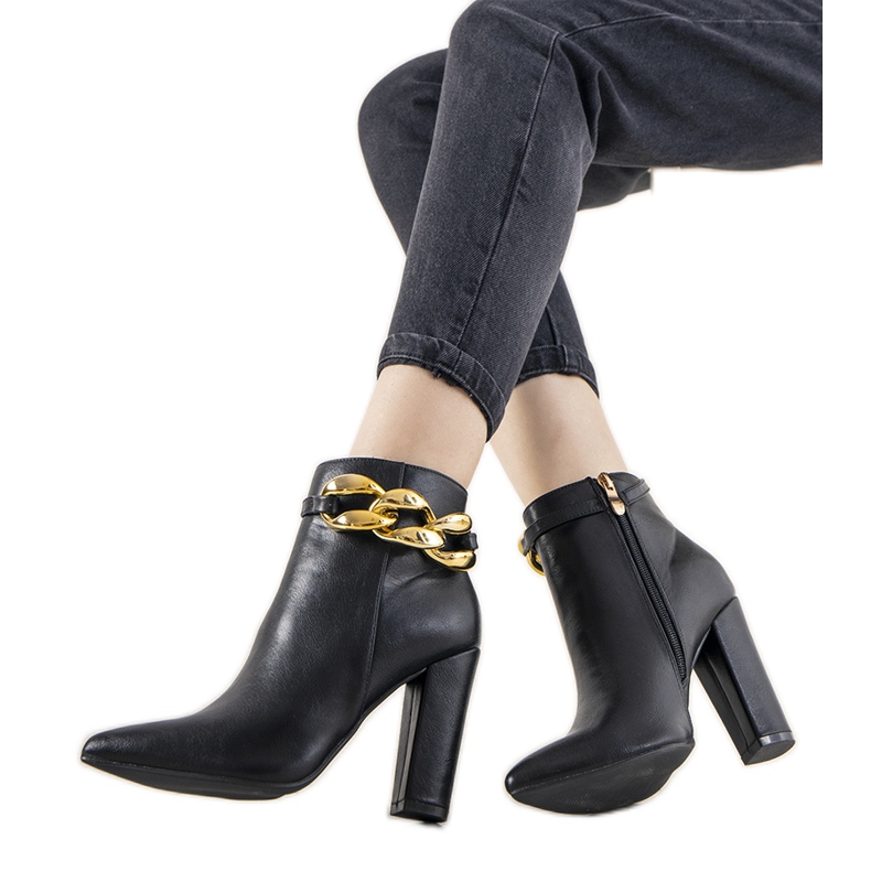 Black elegant boots on the Abilene post