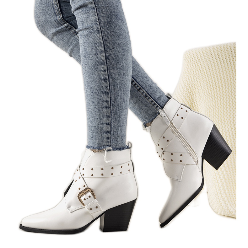 White Jodhpur boots with a buckle and Rubio studs