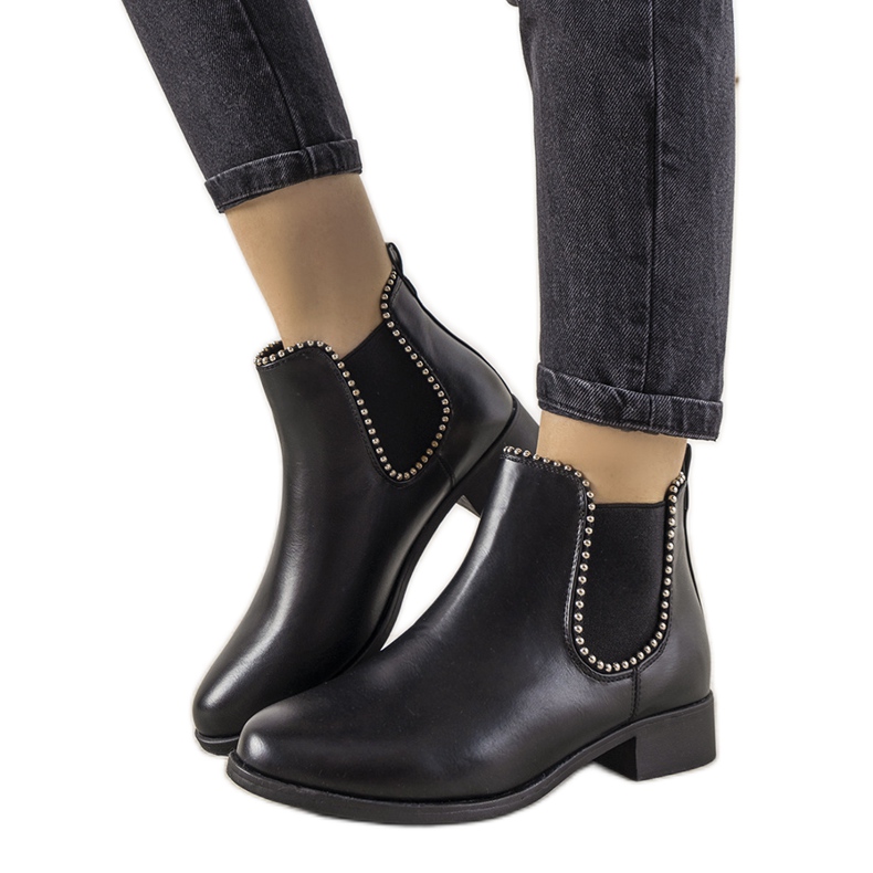 Classic black ankle boots with an elastic band and Merino studs