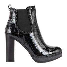 Classic black ankle boots on the Moment post