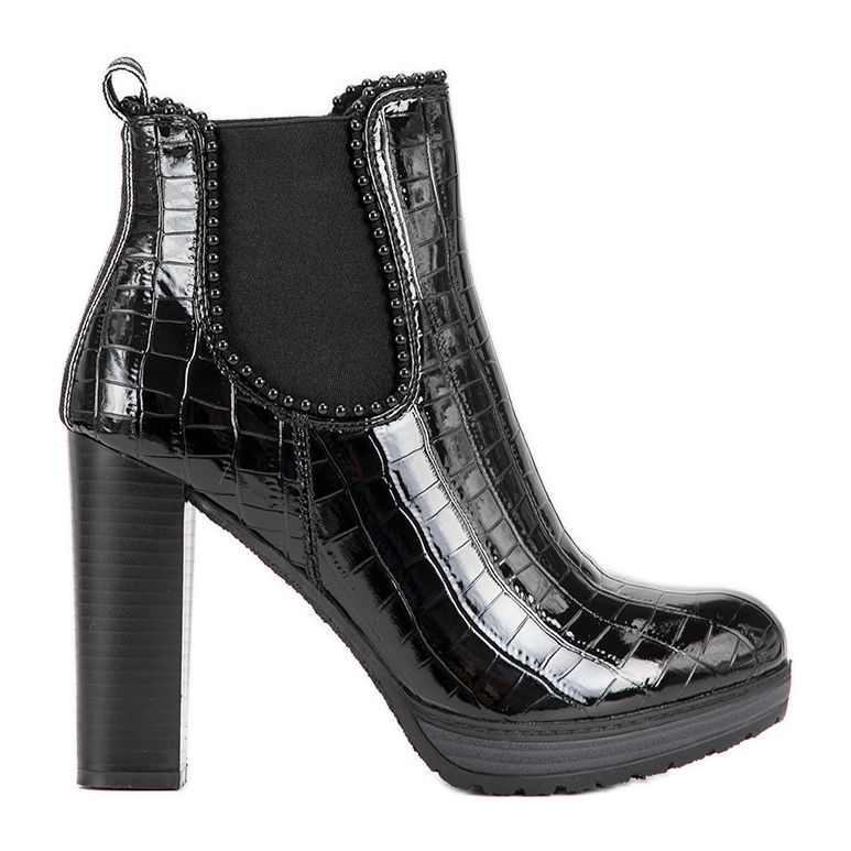 Classic black ankle boots on the Moment post
