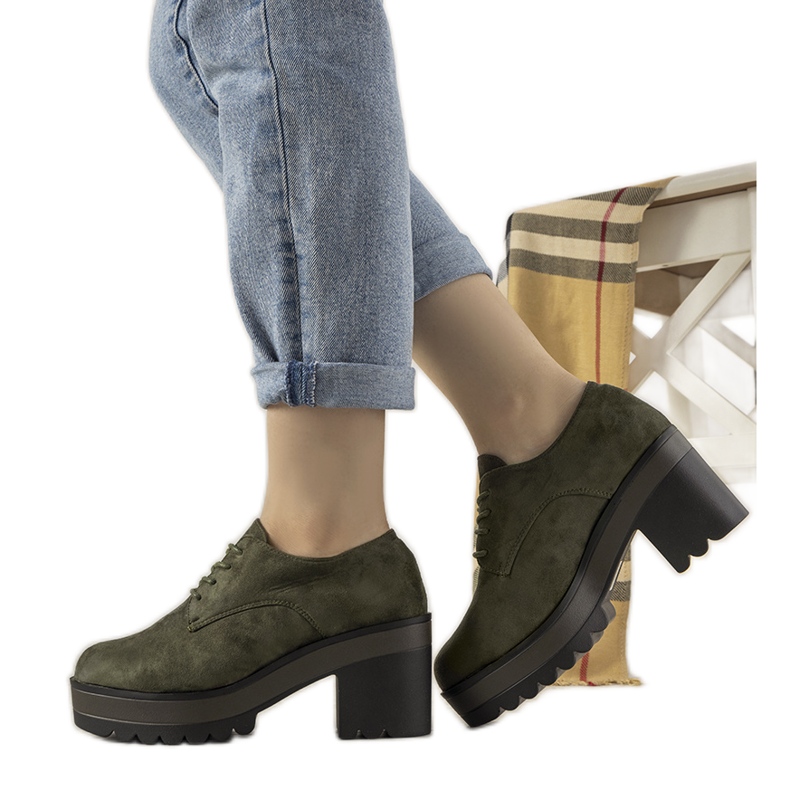 Green, low-cut ankle boots on the Cecina post