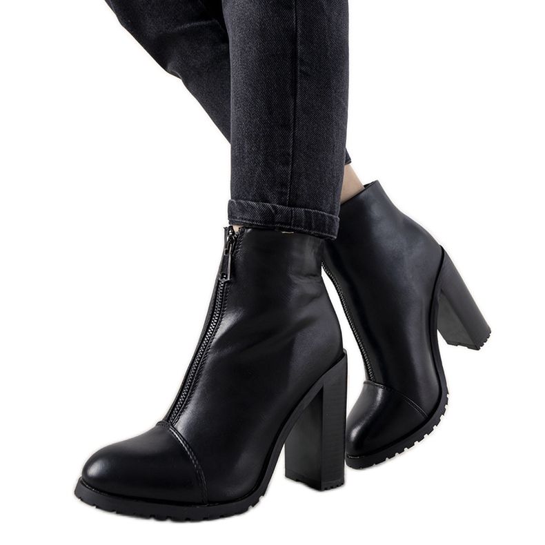 Black elegant women's boots on the Aland post