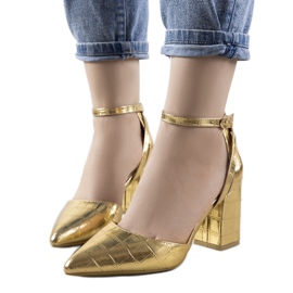 Gold pumps on the Davies pillar golden