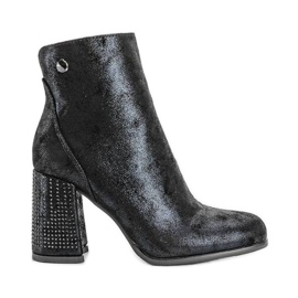 Black ankle boots on the Zodiac post