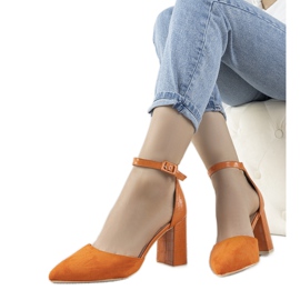 Orange pumps on the post of Natalie Orange pumps on the post of Natalie