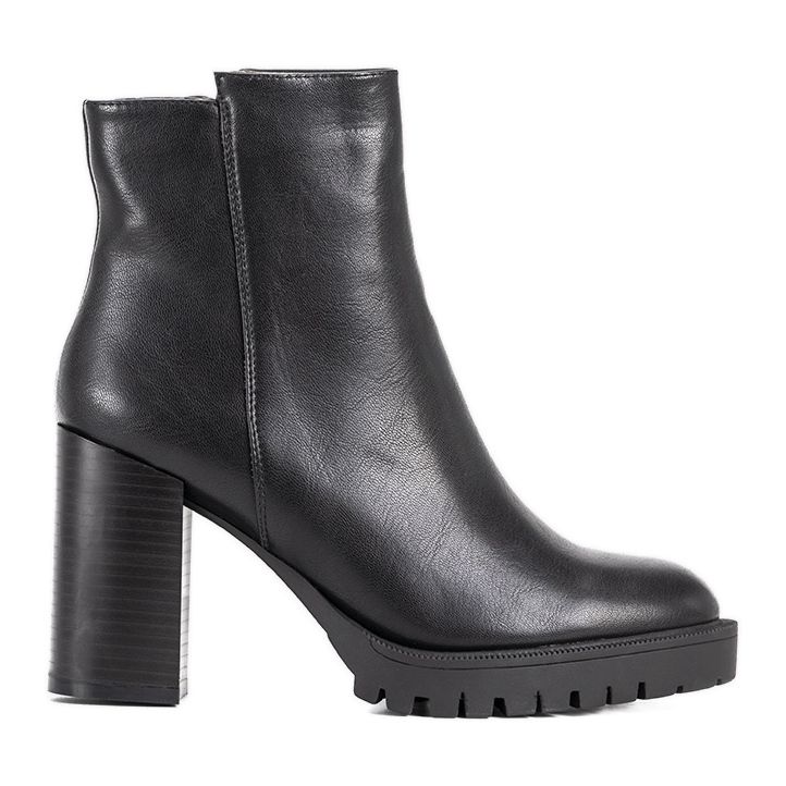 Black boots lacquered in the Minette crocodile skin pattern