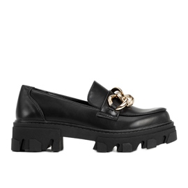 Black loafers on a high Reyna sole