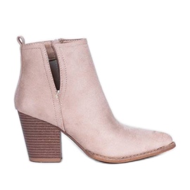 Beige ankle boots on the post of Ginny