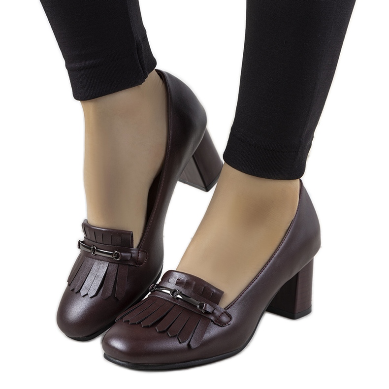 Maroon pumps on a post made of Alice's eco-leather red