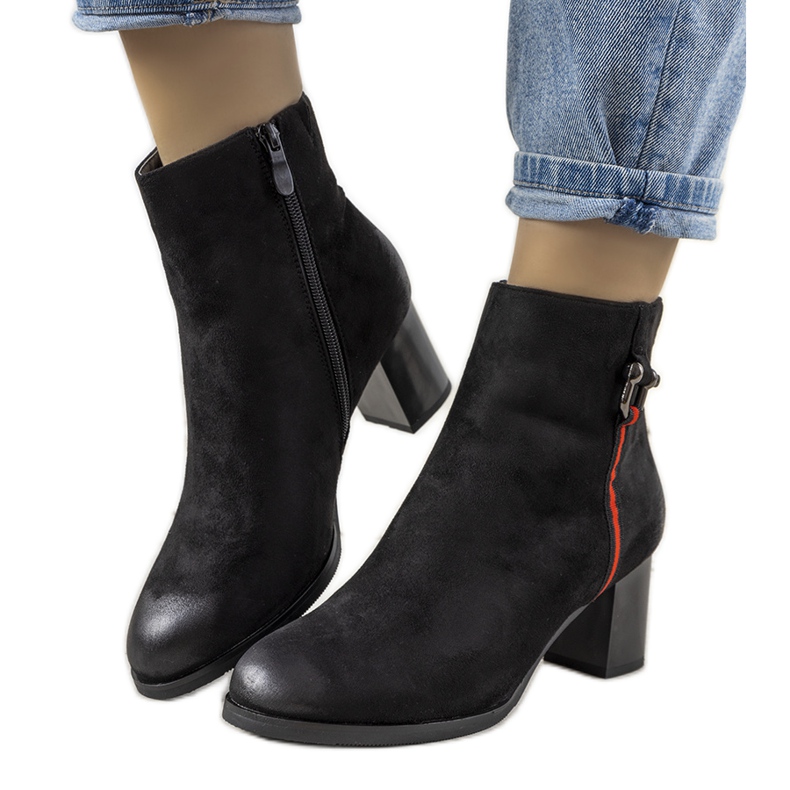 Black boots with abrasions from Montano