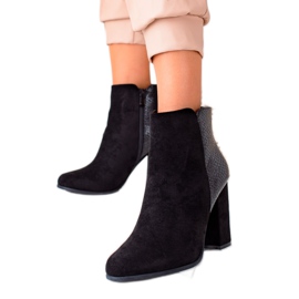 Janessa Stylish black boots on a post